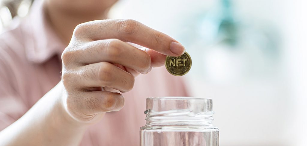 NFT token in the hand of a woman